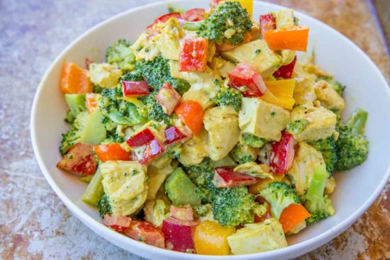 quick and easy chicken salad with curry greek yogurt sauce and mango chunks.