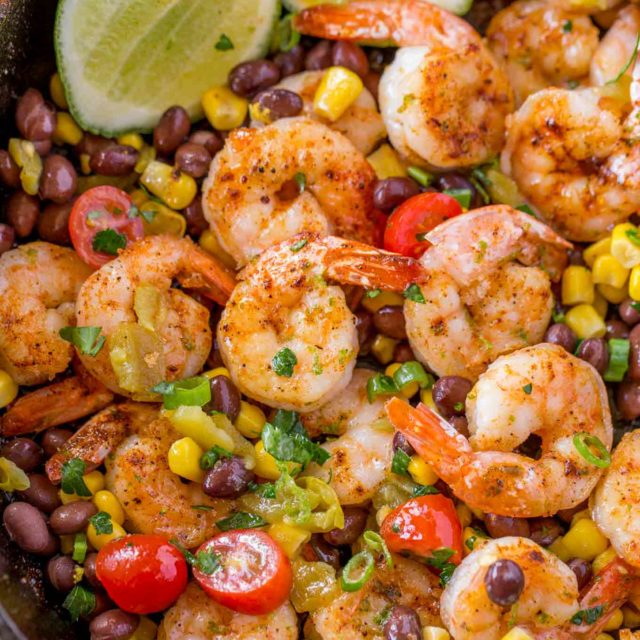 Mexican Shrimp Burrito Bowl made with spiced shrimp, corn, black beans, tomatoes and chilis tossed with a honey lime glaze for just 1 smart point per serving!