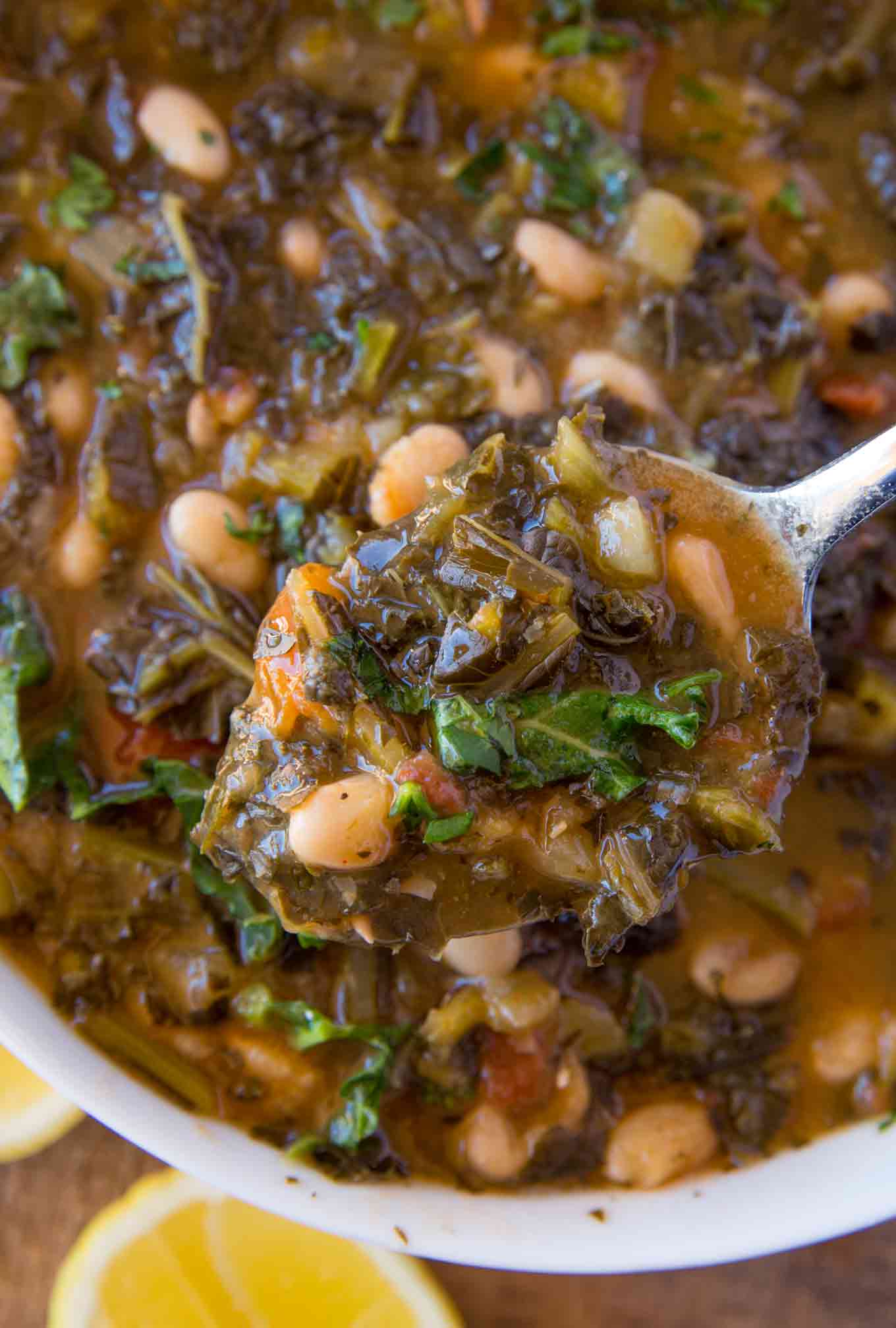 Kale and white bean soup on spoon