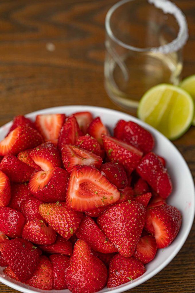 Tequila strawberries in a white bowl