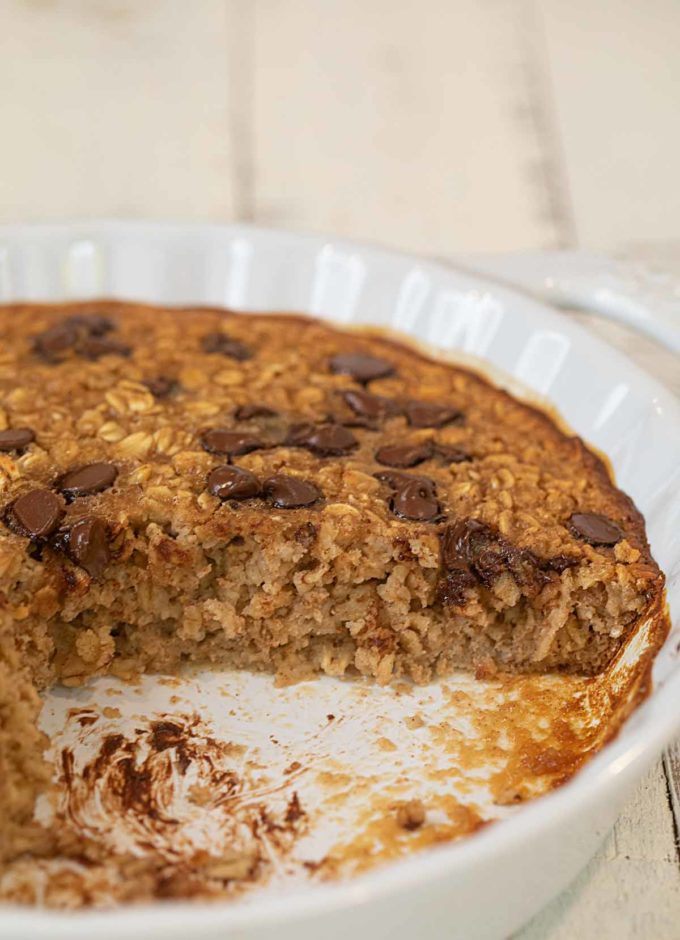 Chocolate Chip Baked Oatmeal in pie plate with slice removed