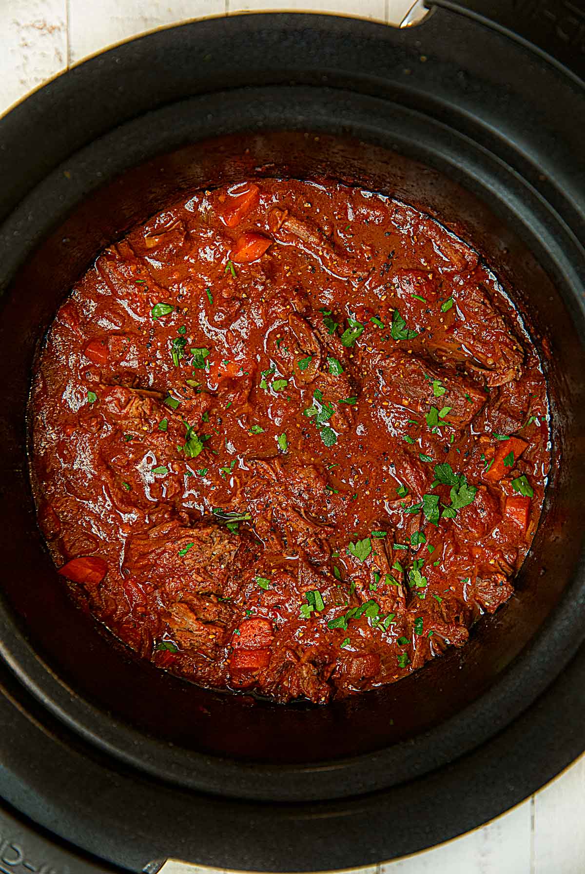 Healthy Beef Ragu in slow cooker after cooking and shredding