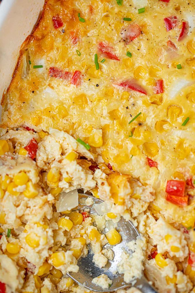 Healthy Swiss Corn Casserole in baking dish with serving removed