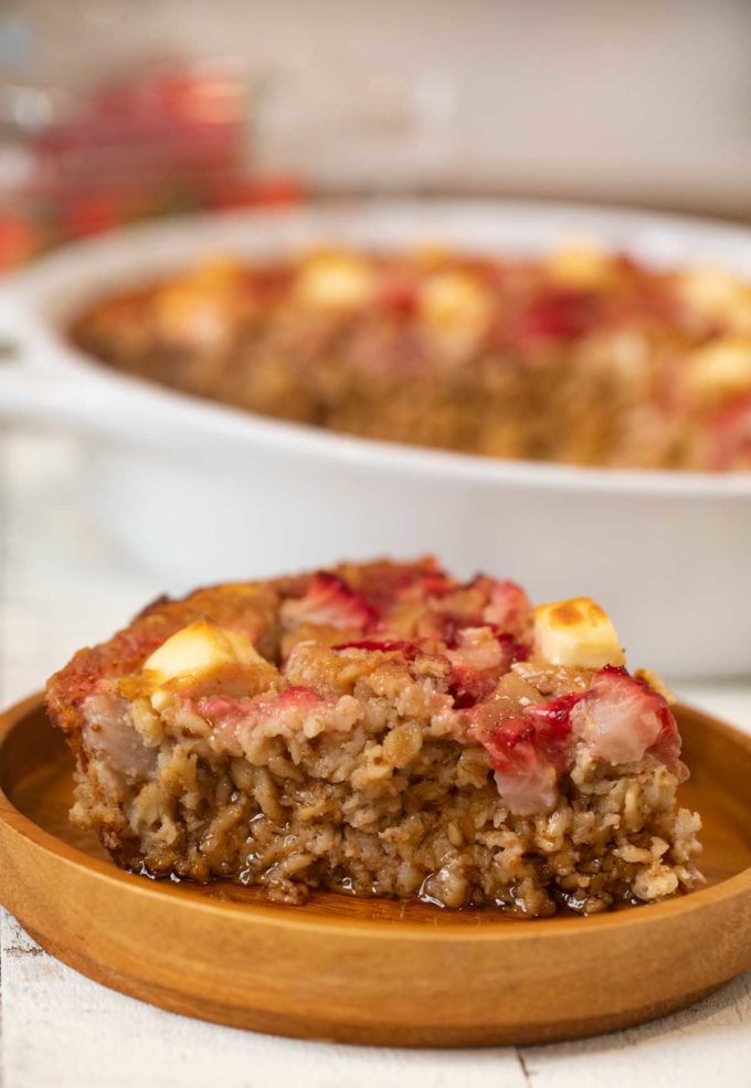 Strawberry Cream Cheese Baked Oatmeal on wooden plate