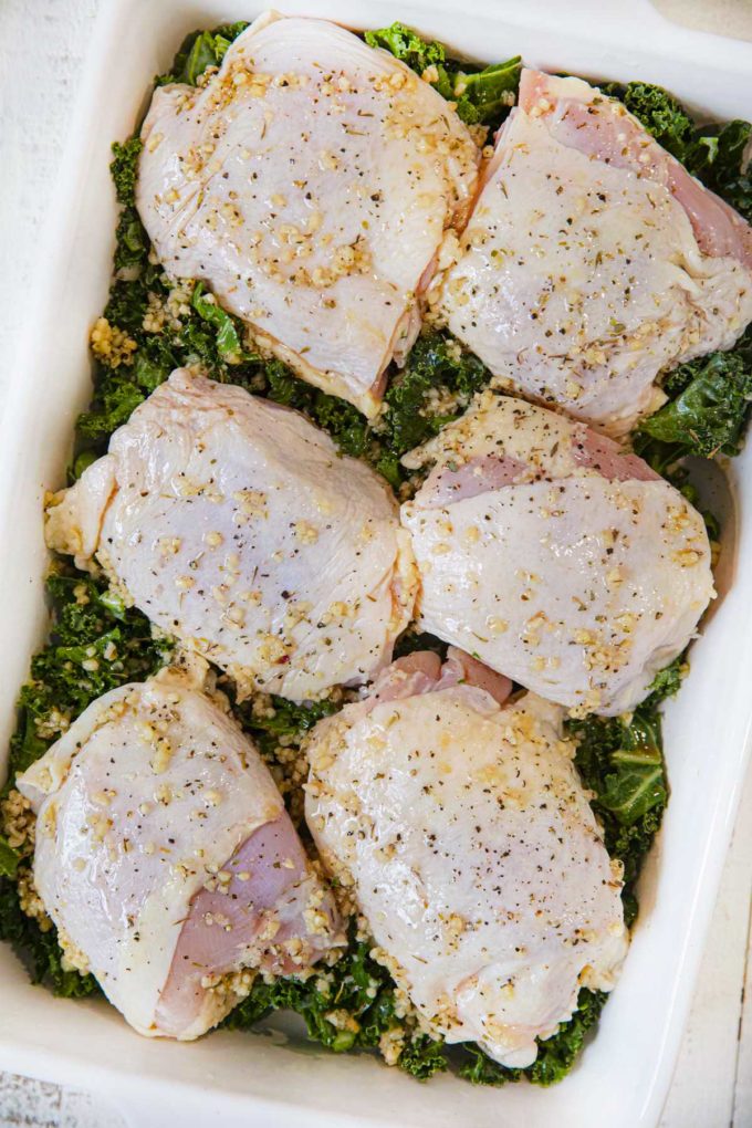 Garlic Braised Chicken and Kale in baking dish before cooking