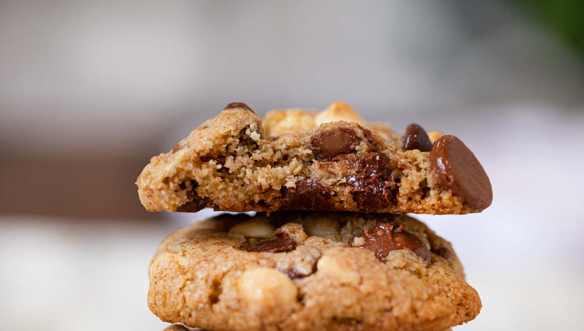 Bite taken out of Healthy Triple Chocolate Cookies in a stack