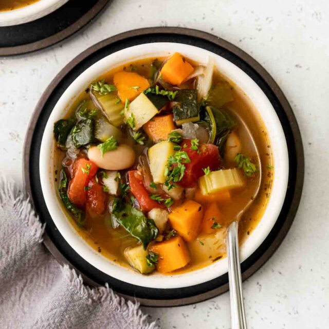 Tuscan-Vegetable-Soup in bowl with spoon