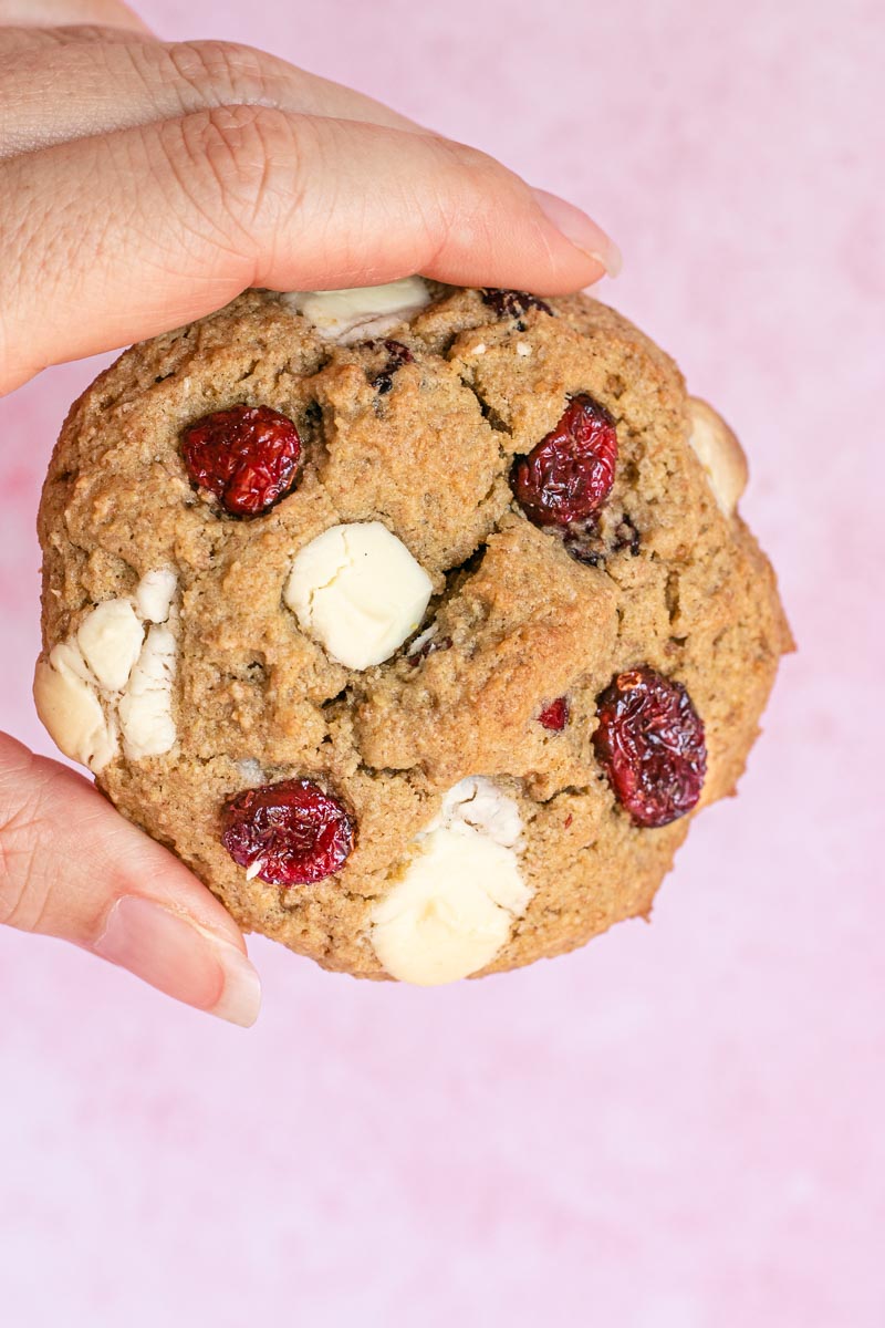 White Chocolate Cranberry Cookies held in hand