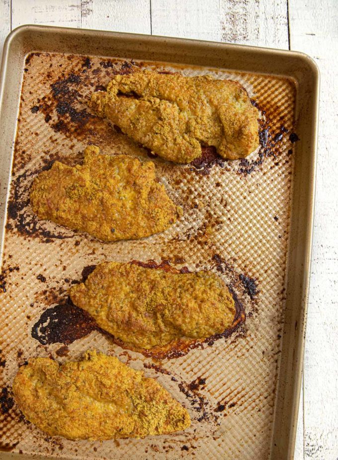 Falafel Crusted Chicken baked chicken breasts on baking sheet