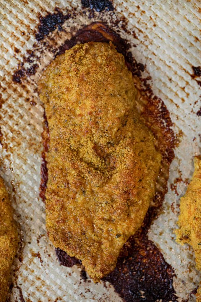 Falafel Crusted Chicken on baking sheet