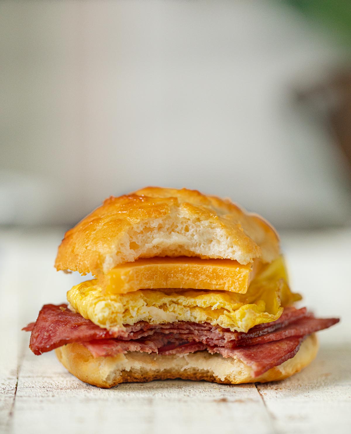 Healthy Bacon and Egg Cheese Biscuit Sandwiches on cutting board