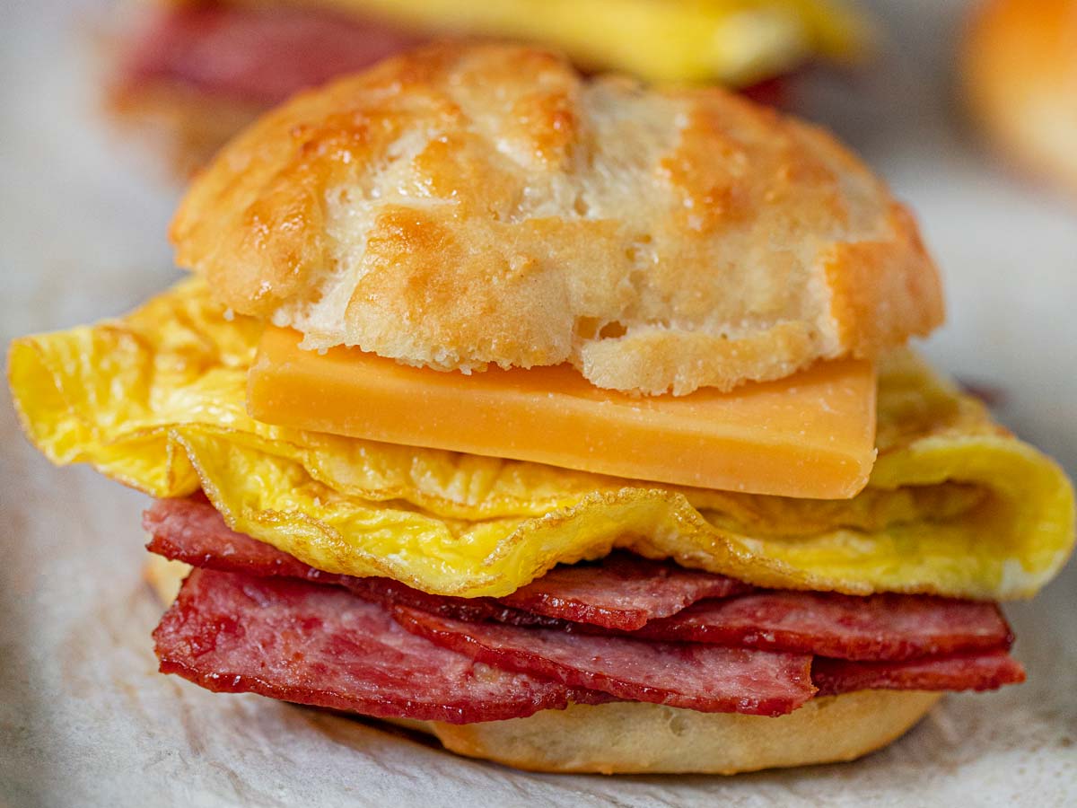 Healthy Bacon and Egg Cheese Biscuit Sandwiches on baking sheet