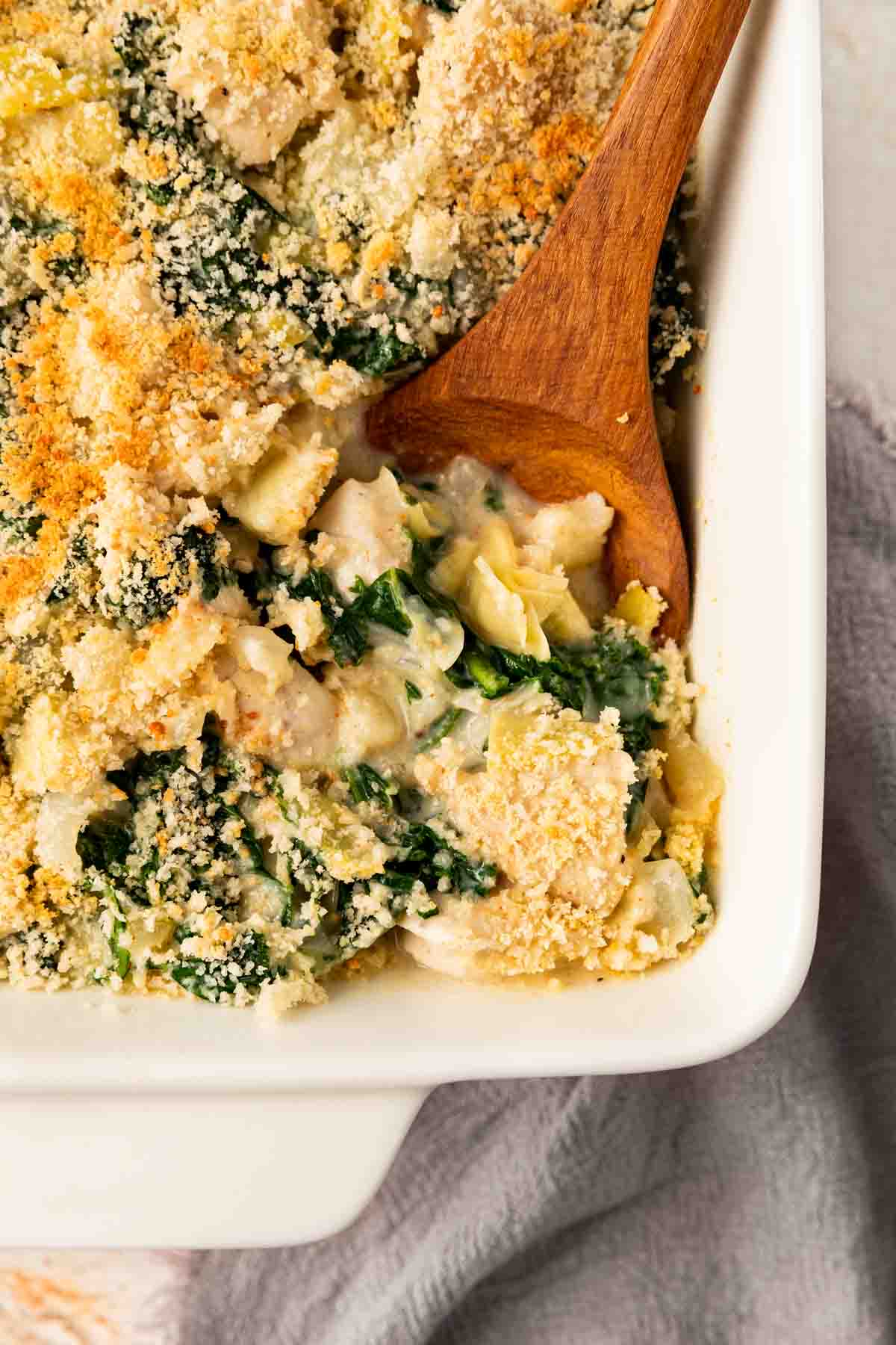 Kale Artichoke Parmesan Chicken Casserole in baking dish