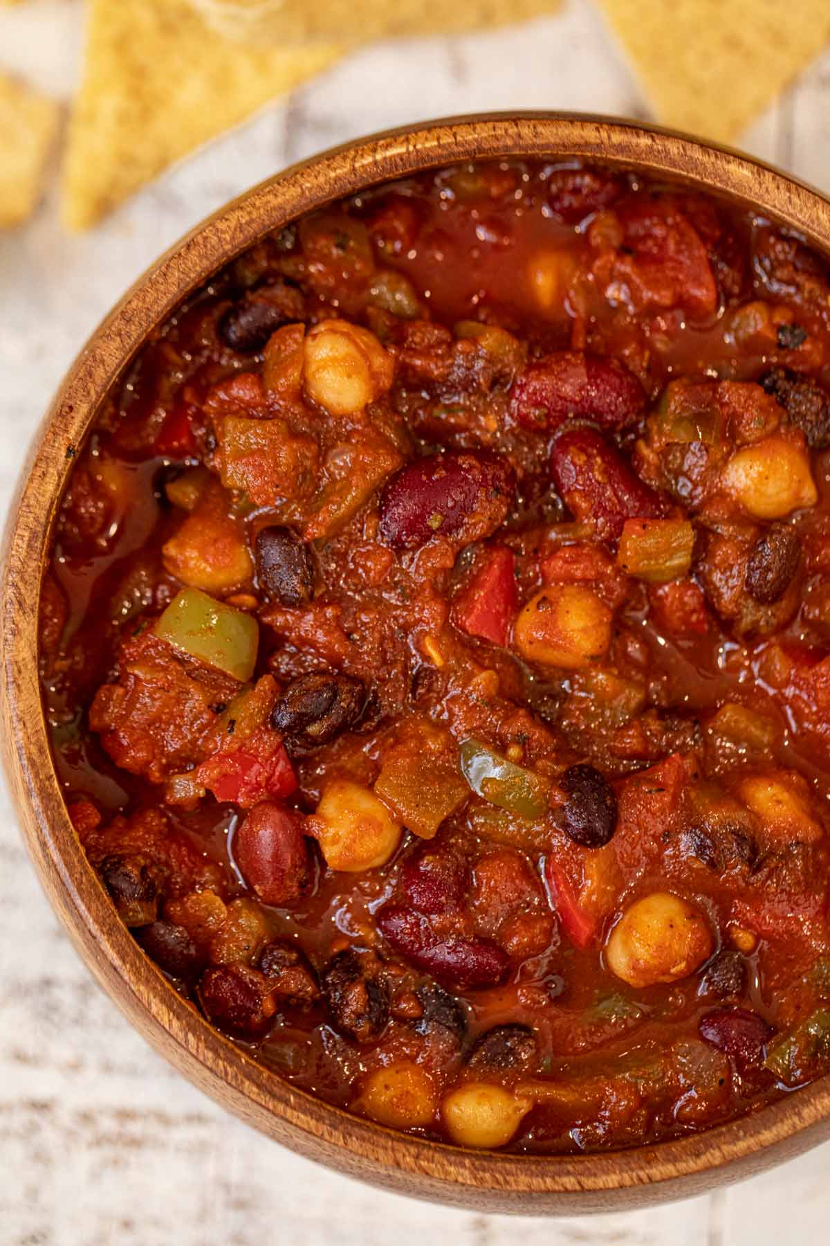 Vegetarian Chili in wooden bowl with tortilla chips