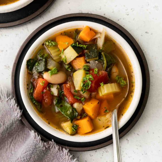 Tuscan Vegetable Soup in bowl with spoon