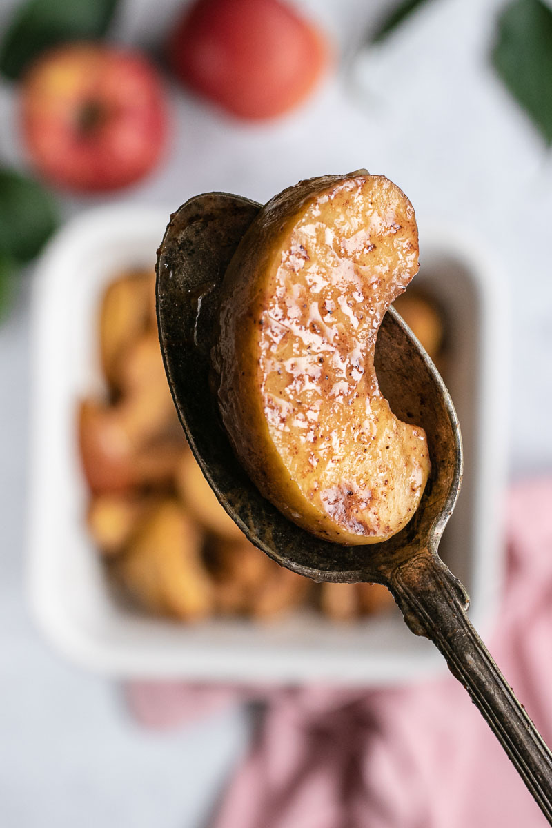 Healthy Baked Sliced Apples close up on spoon