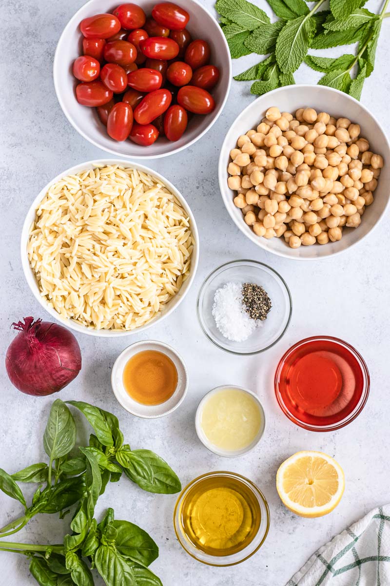 Orzo Salad ingredients in bowls