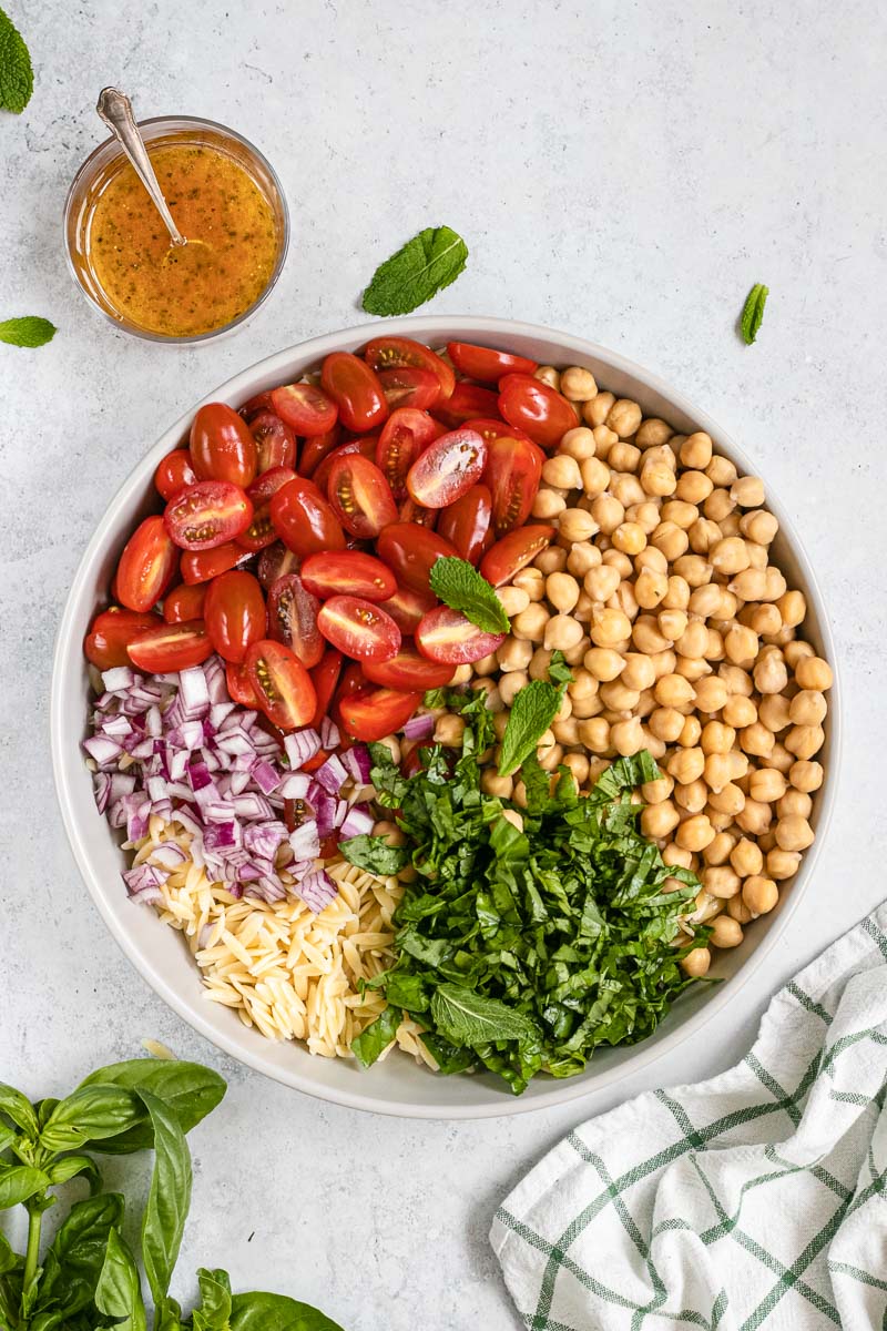 Orzo Salad ingredients in bowl