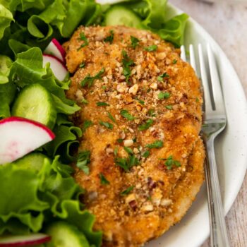 Pecan-Crusted Chicken on plate with salad