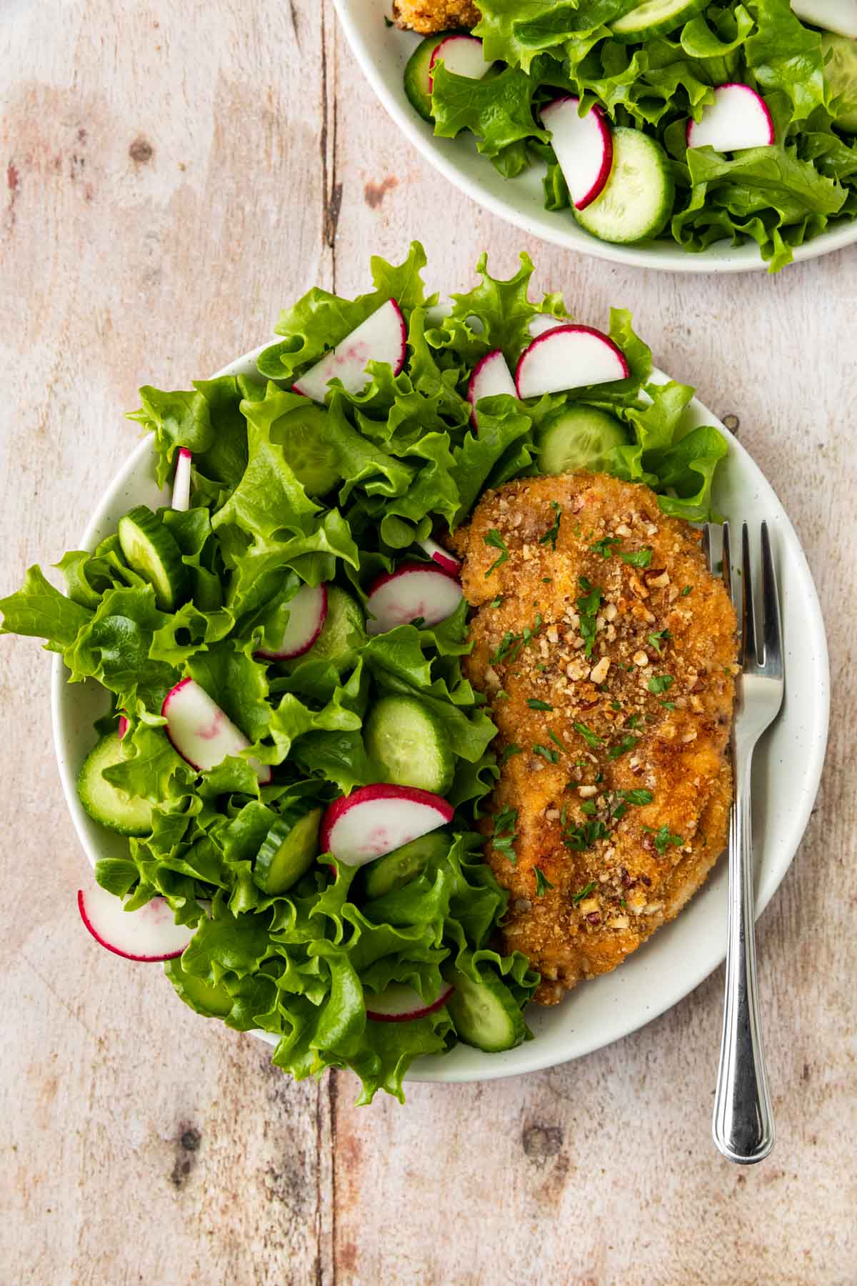 Pecan-Crusted Chicken on plate with salad