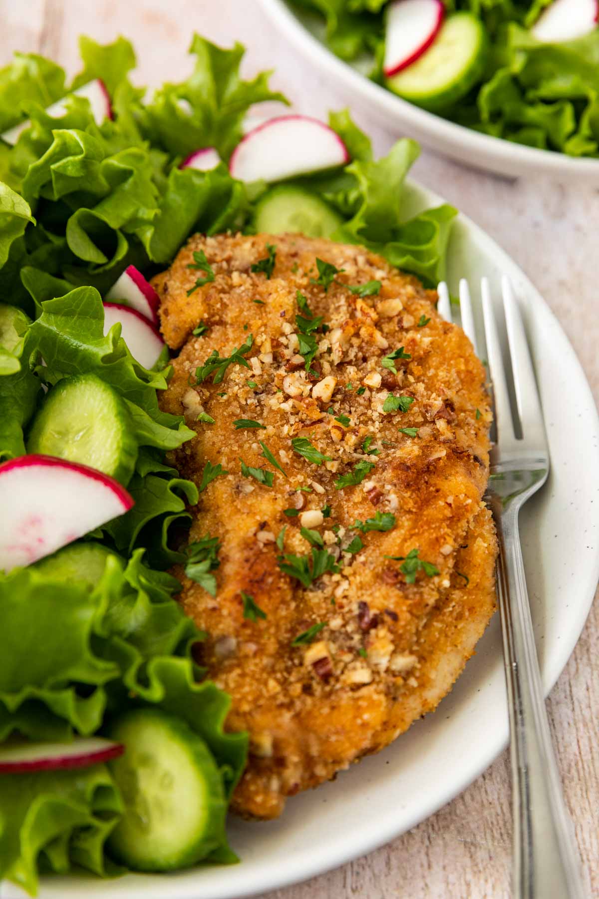 Pecan-Crusted Chicken on plate with salad