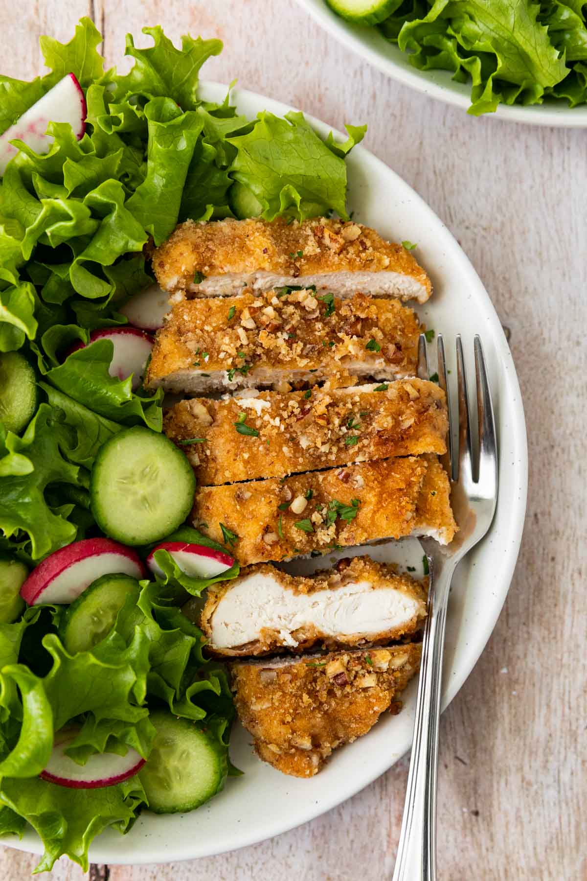 Pecan-Crusted Chicken on plate with salad