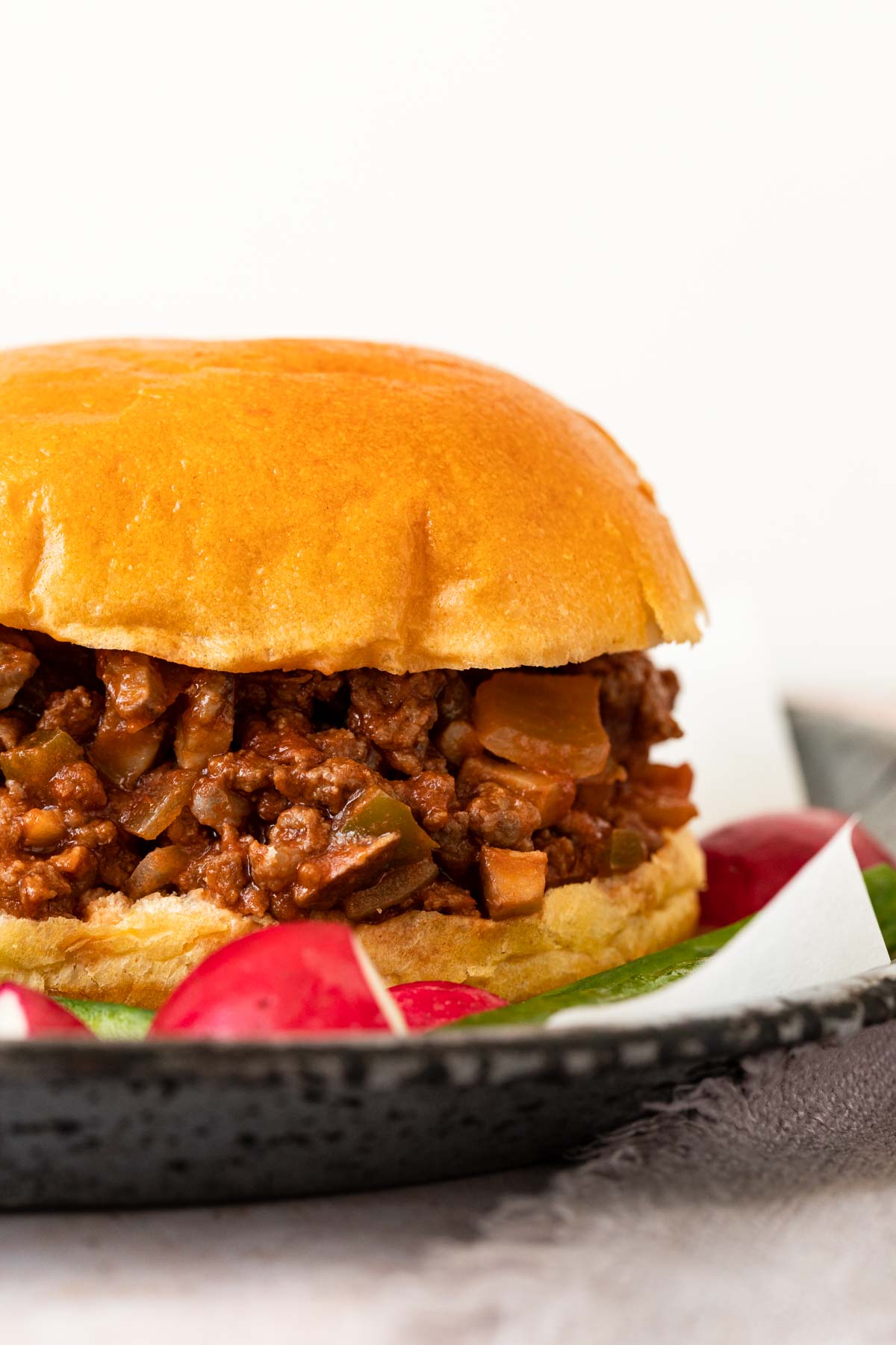 Healthy Sloppy Joes closeup on a plate with vegetables