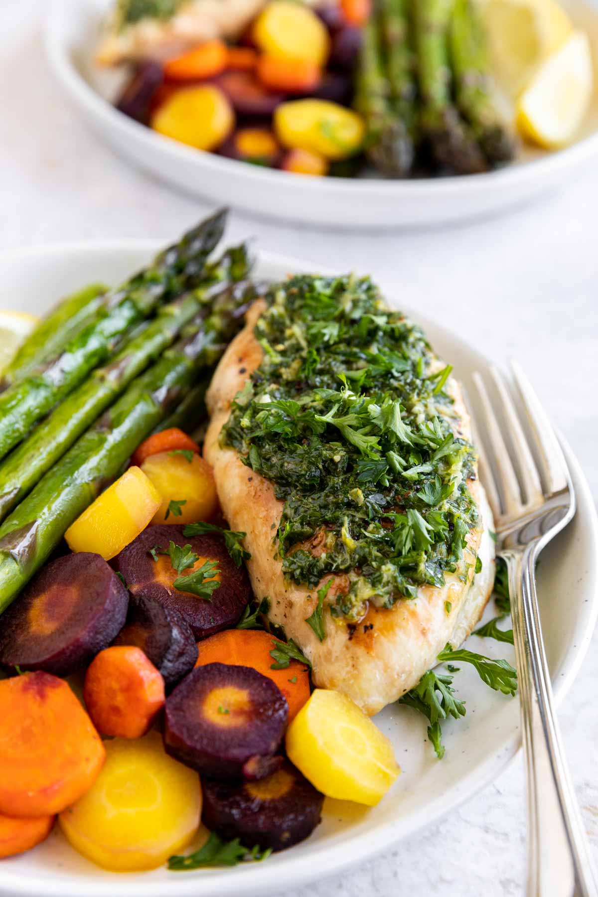 Roasted Chicken with Lemon Garlic Herb Sauce on a plate