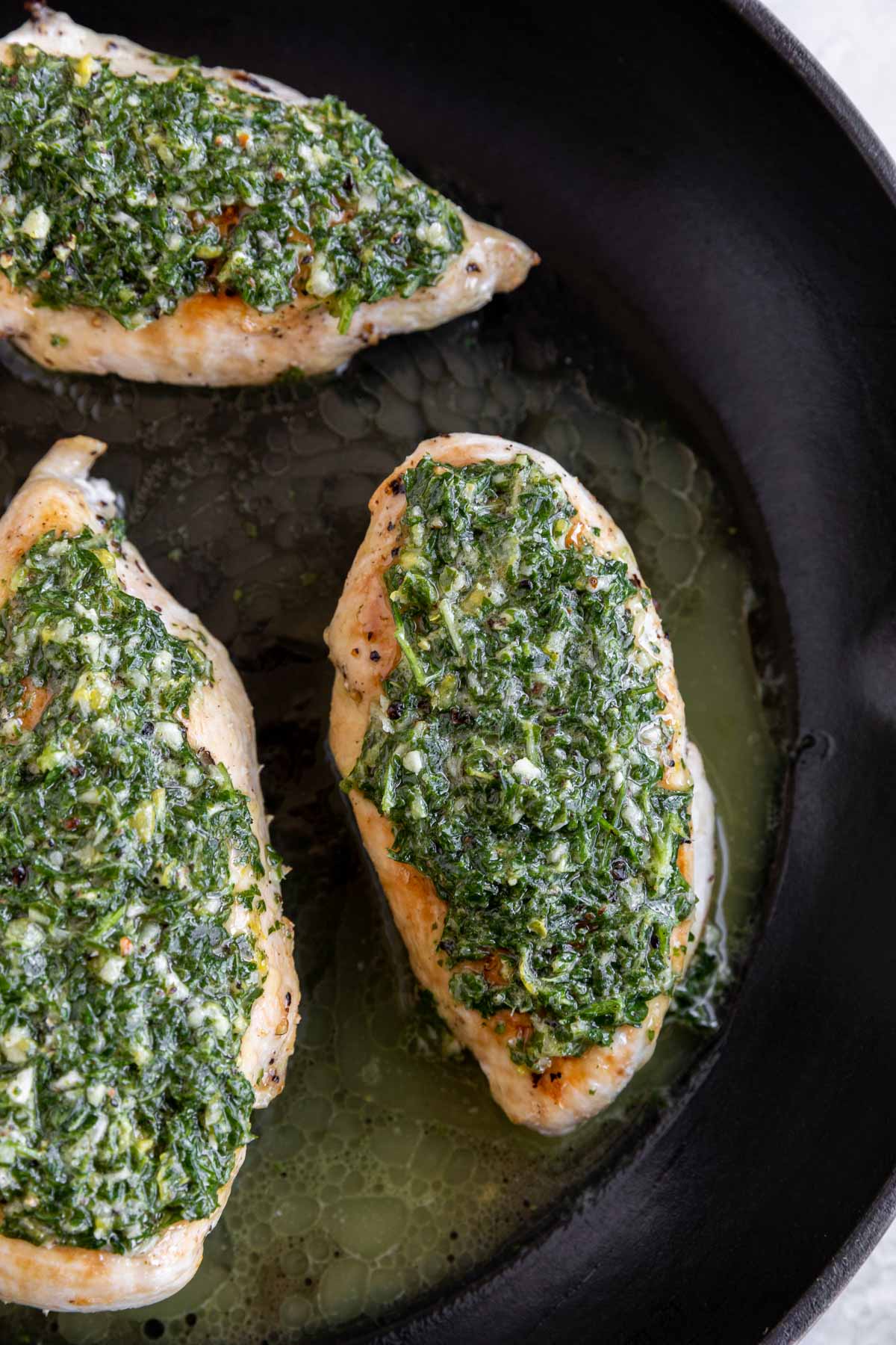 Roasted Chicken with Lemon Garlic Herb Sauce in a pan