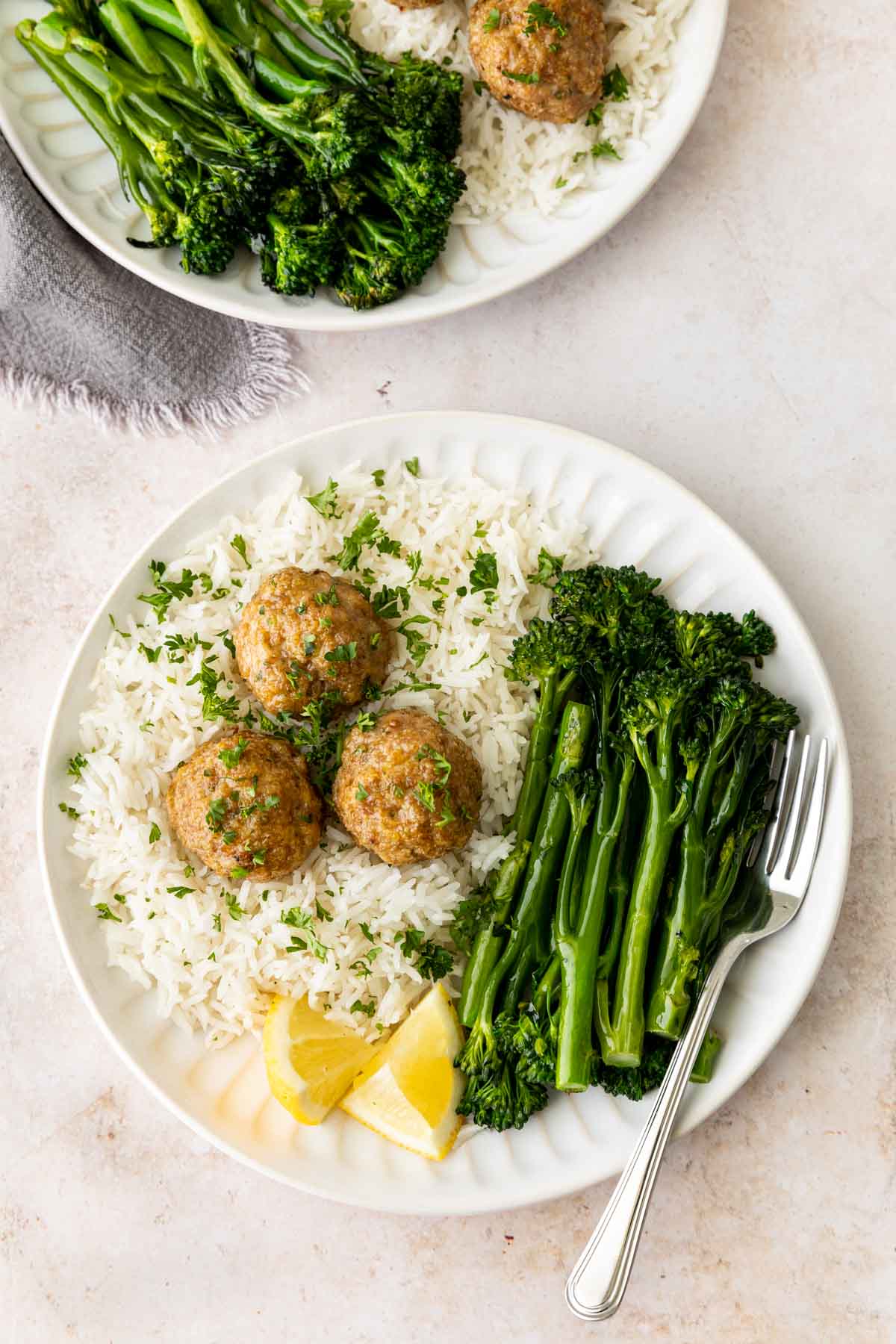 Turkey Meatballs on a plate served with rice and broccolini