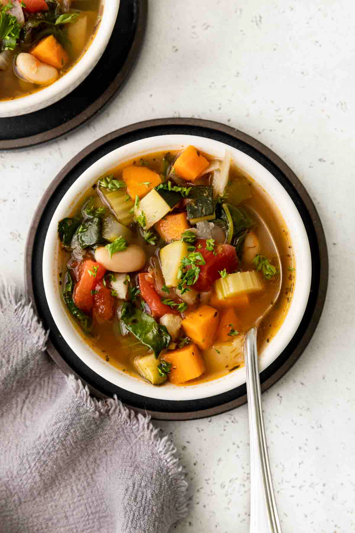 Tuscan-Vegetable-Soup in bowl with spoon