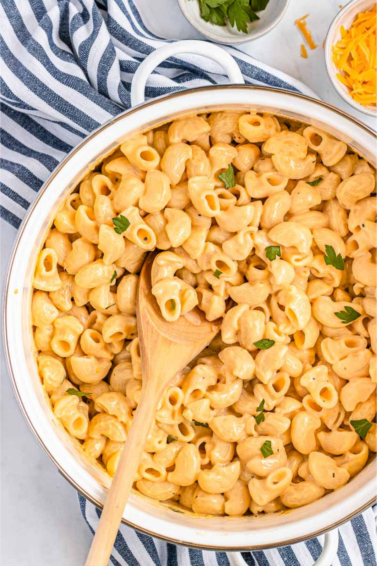 Healthy Mac and Cheese in a pot with wooden spoon