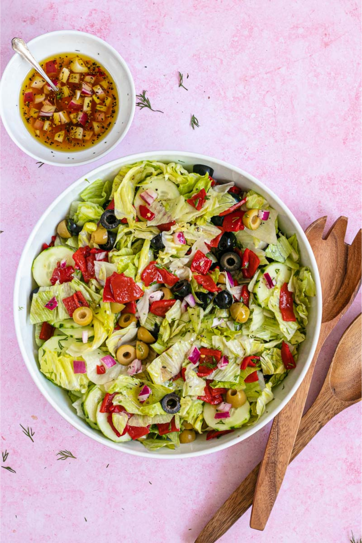 Chopped Salad in a bowl with wooden spoon on the side