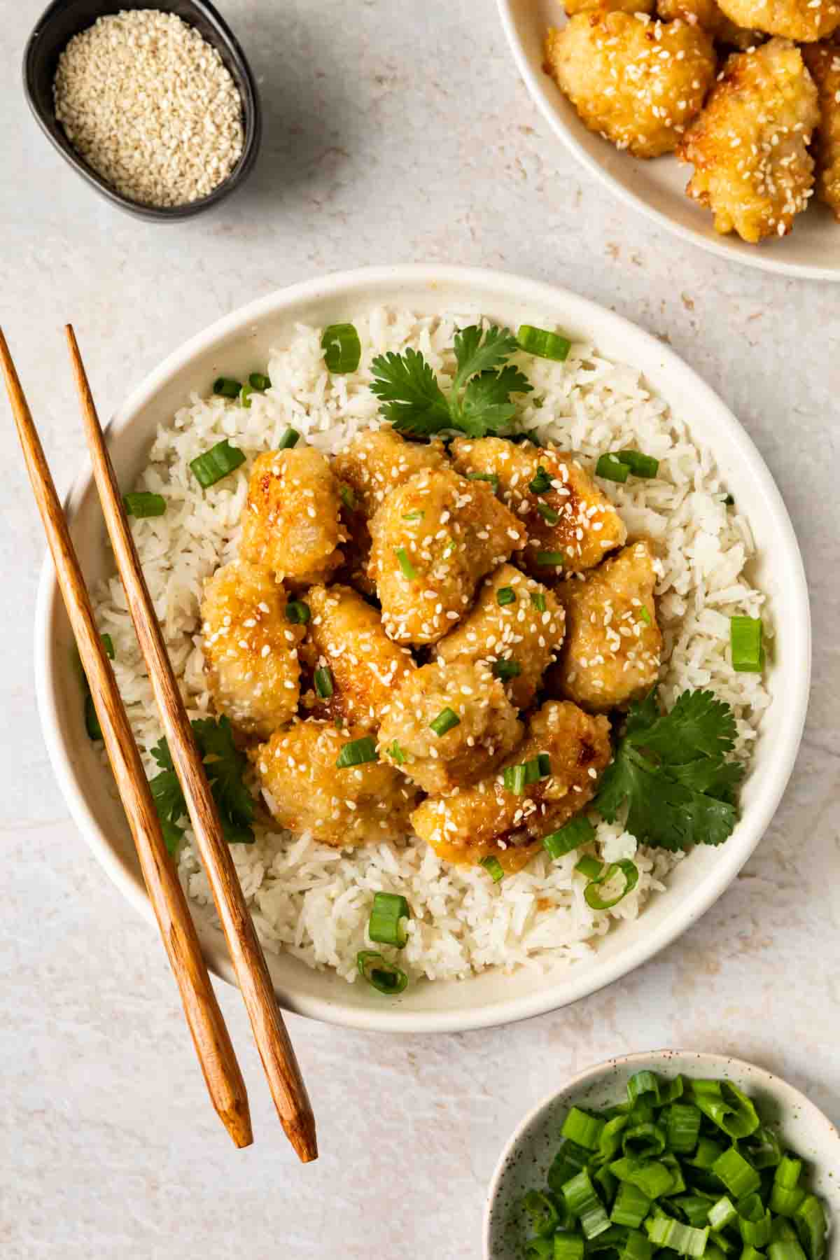 Baked Chinese Honey Chicken  served in bowl with chopsticks