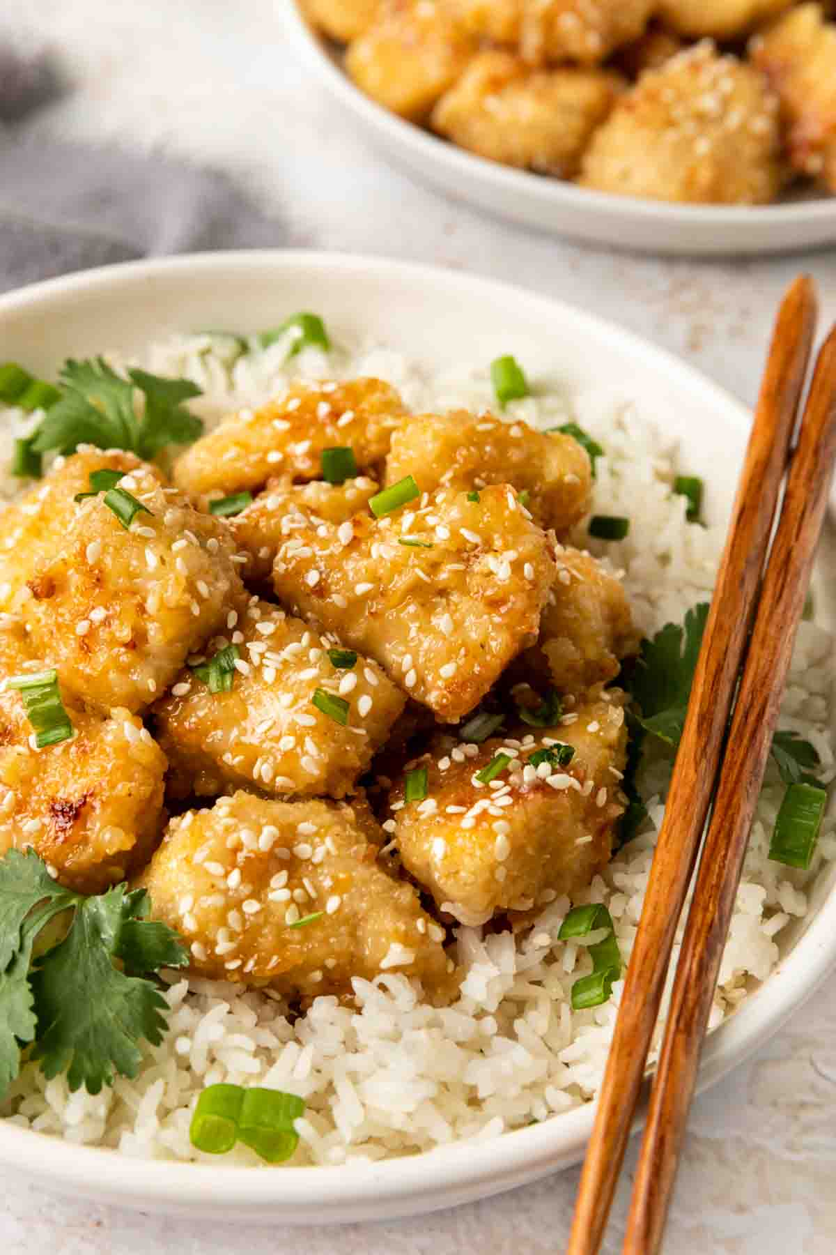 Baked Chinese Honey Chicken  served in bowl with chopsticks
