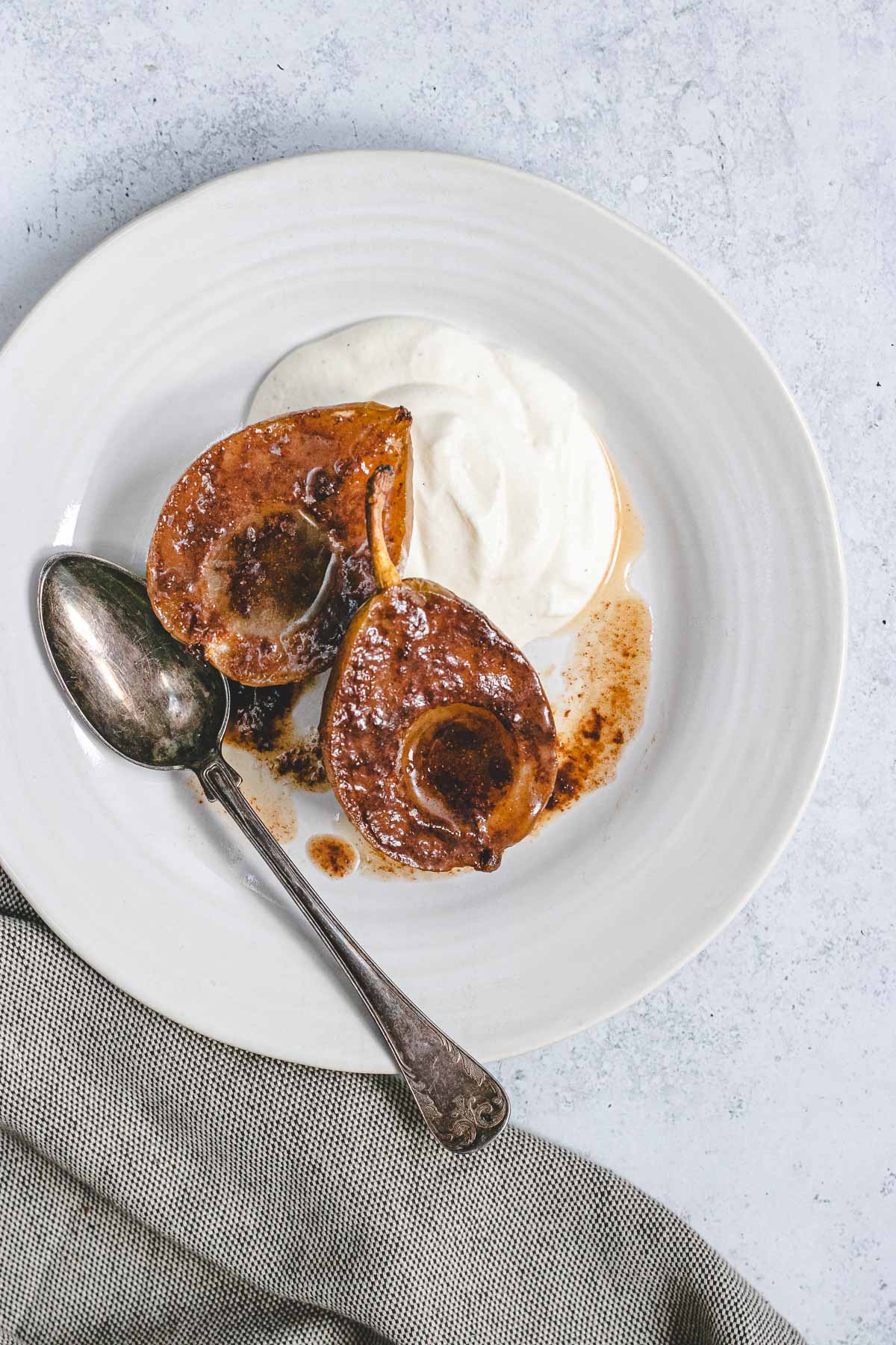 Baked Pears in bowl with spoon