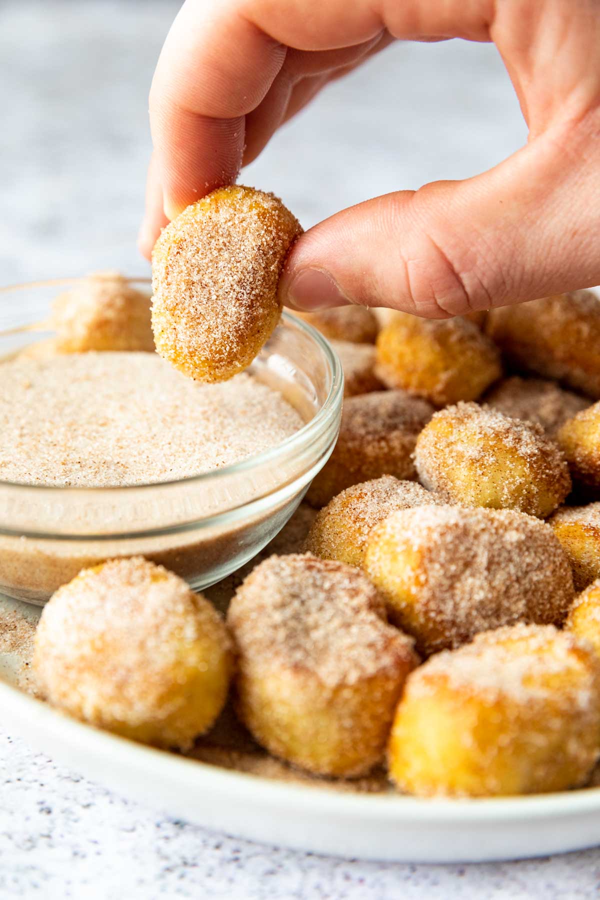 Cinnamon Sugar Pretzel Bites on platter and dipped