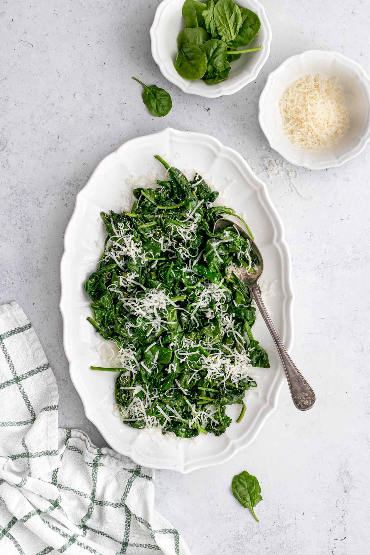 Sauteed Spinach on platter with spoon