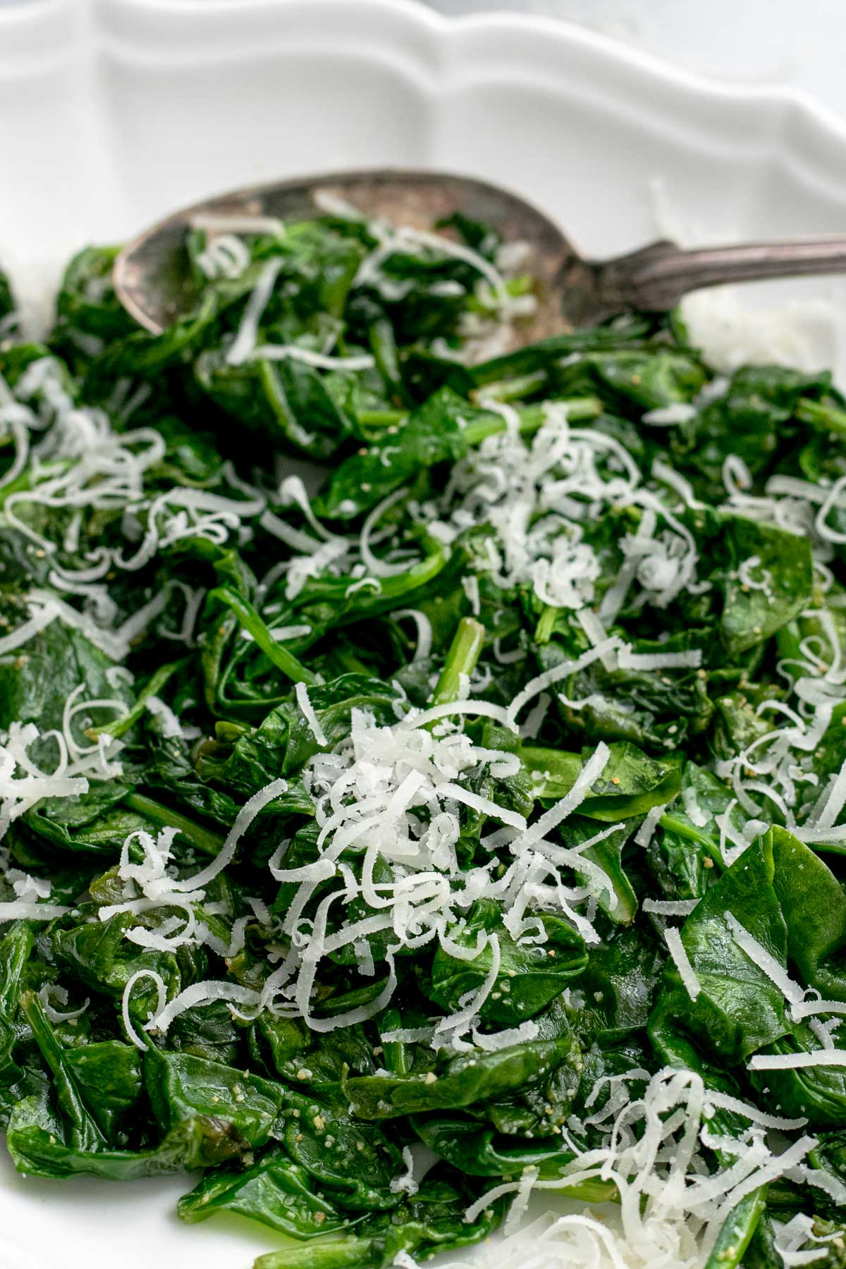 Sauteed Spinach on platter with spoon