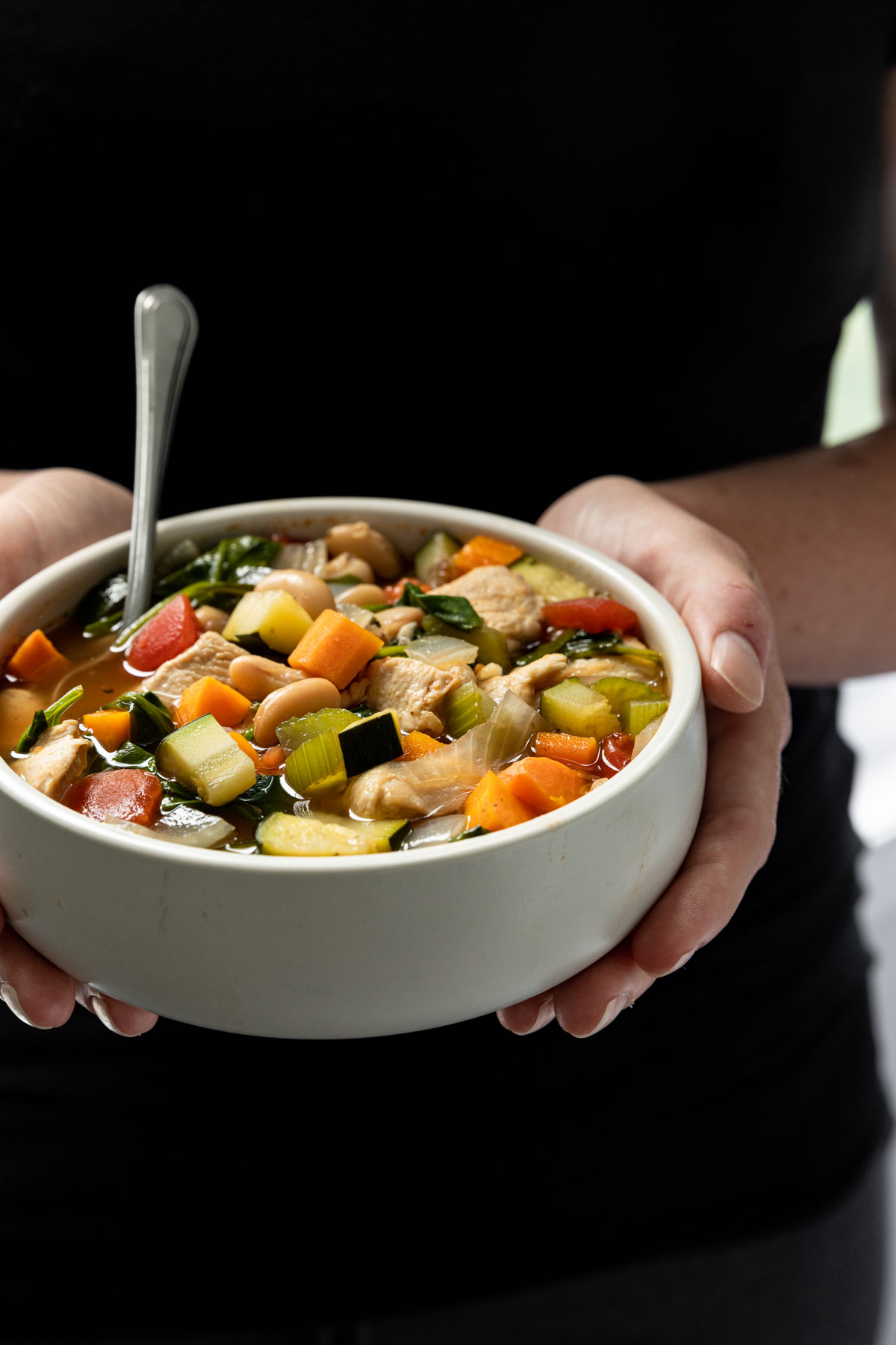 Tuscan Chicken Spinach Soup in a bowl 