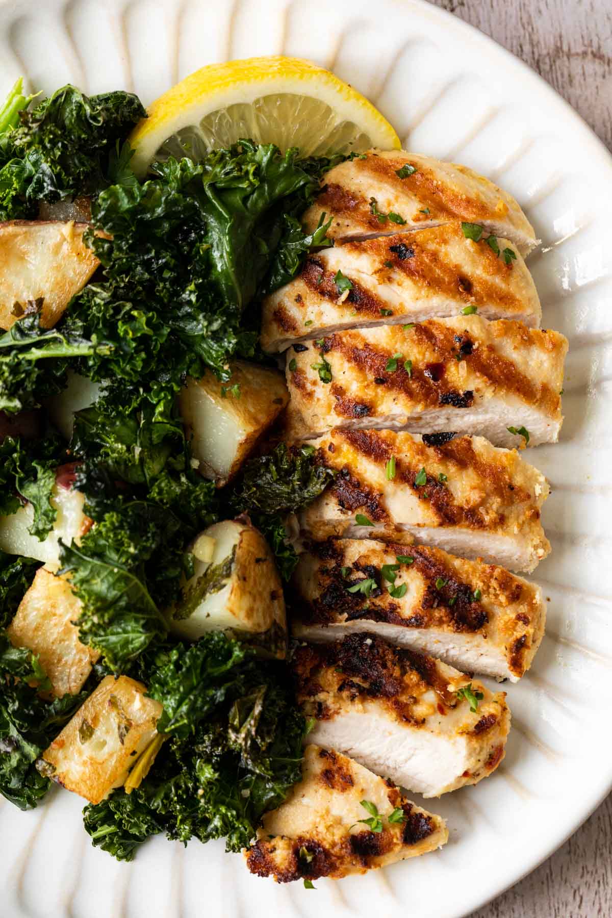 Sheet Pan Roasted Garlic Chicken with Kale and Potatoes on a plate 